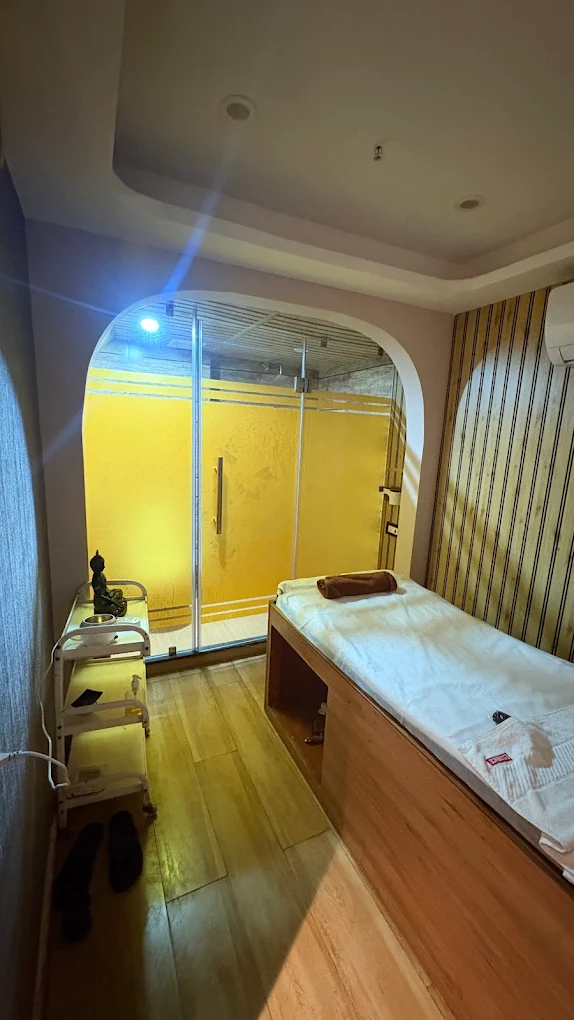Serene wood-paneled treatment room at Morphosis Spa